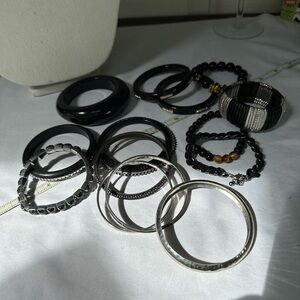 Large group of 15 black vibe bracelets